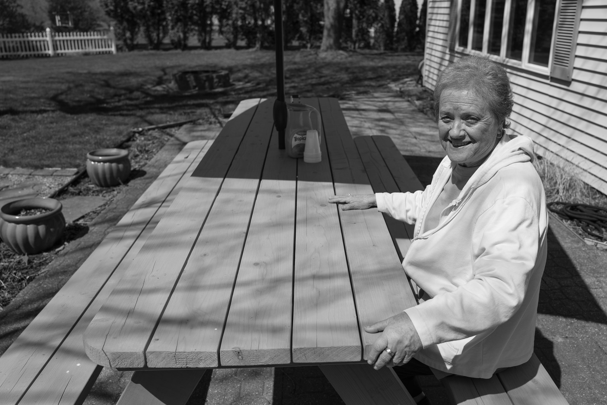 Mom at the picnic table dad built. Leica Q2 Monochrom
