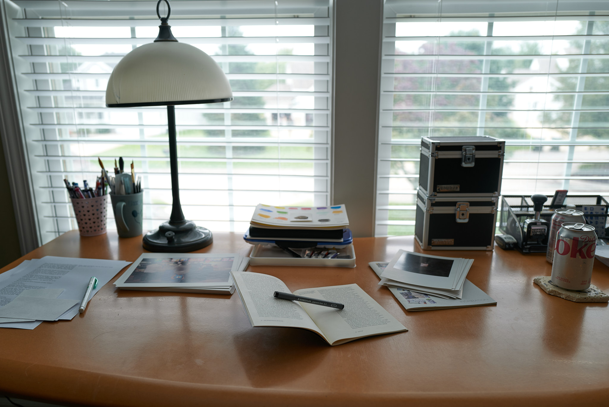 Desk with notebooks and paper tools